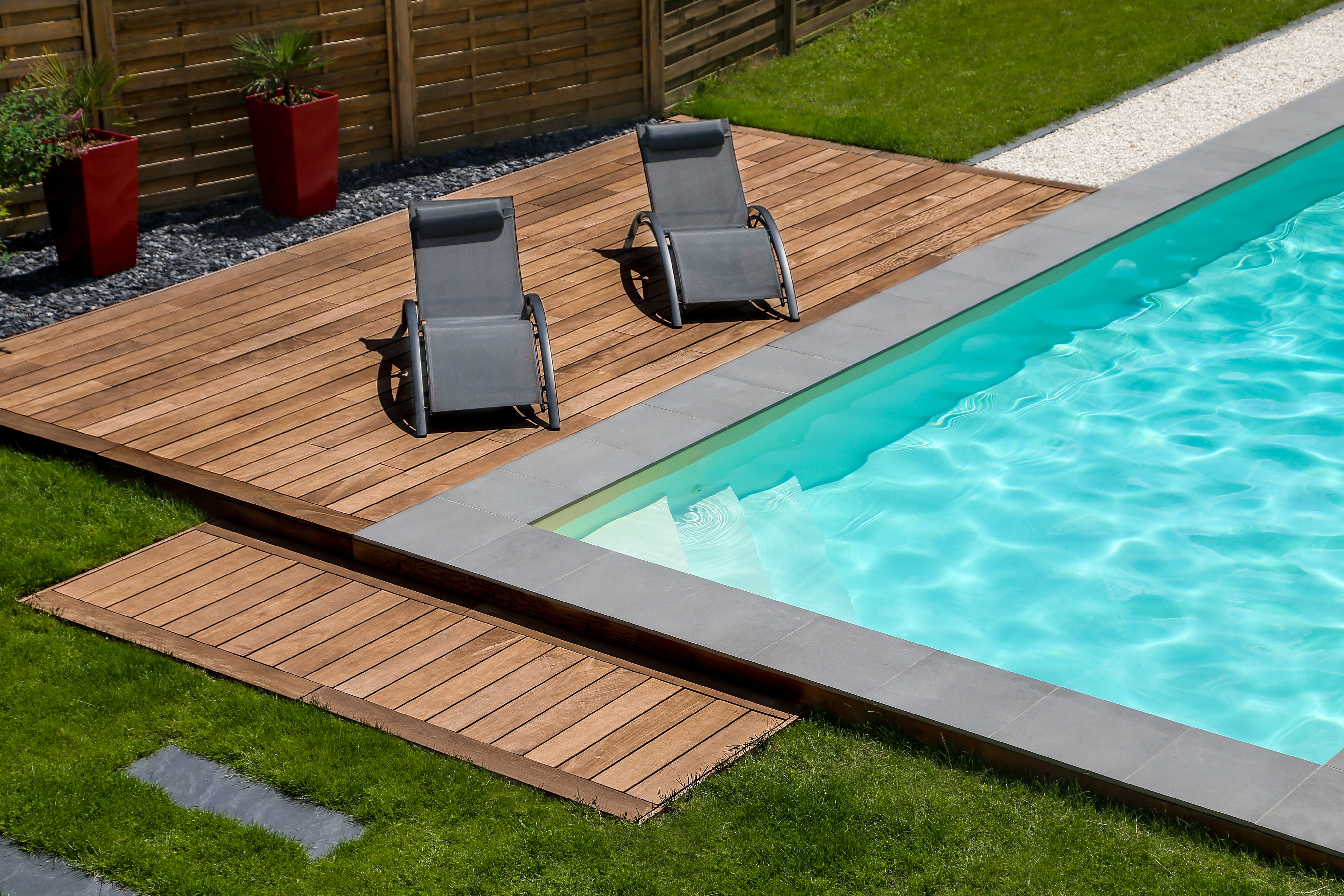 beautiful,swimming,pool,and,exotic,wooden,terrace,with,sunbath,chair